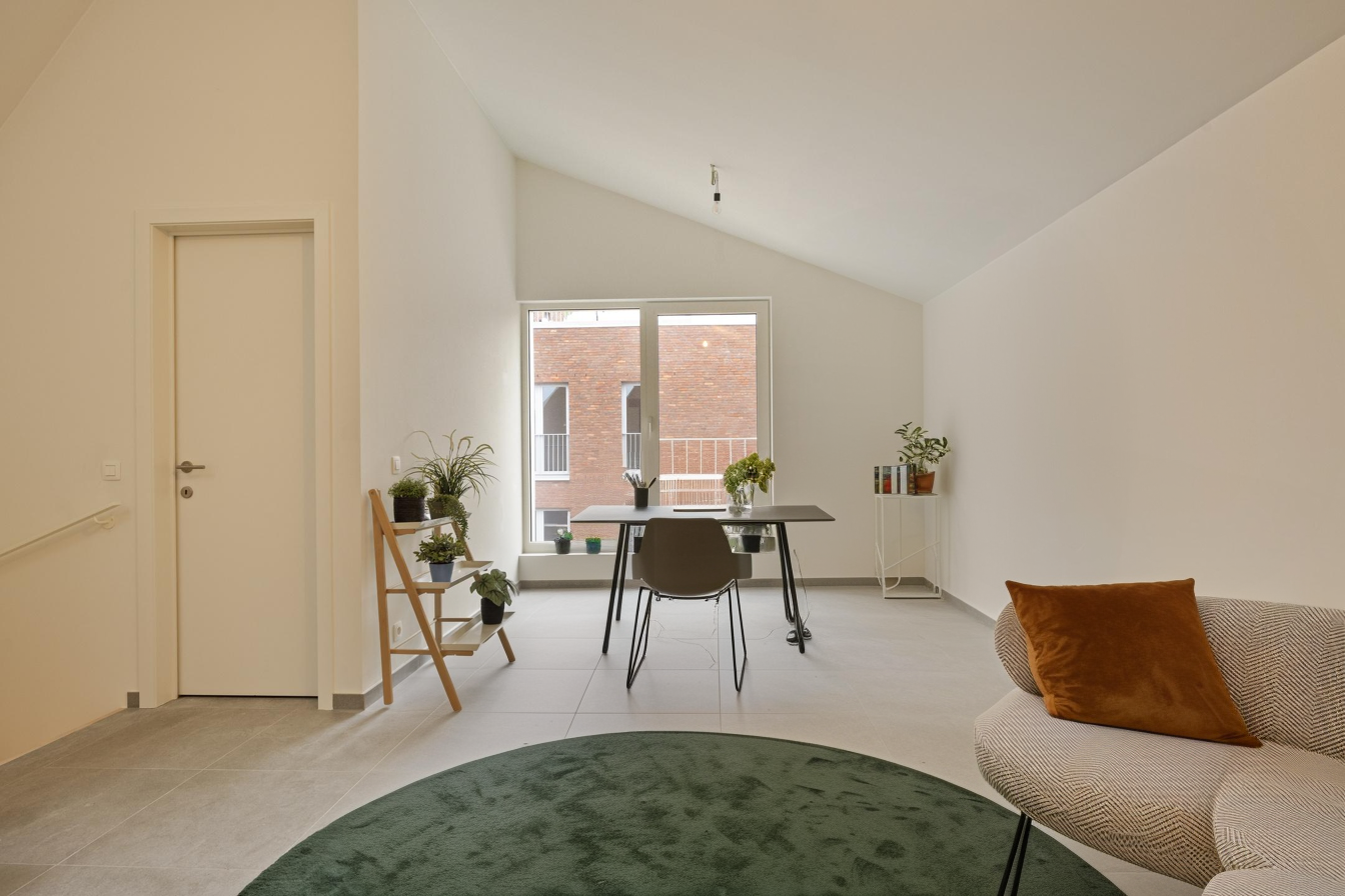 Leefruimte in een gezinswoning van het woonproject Saffrou in Oudenaarde.